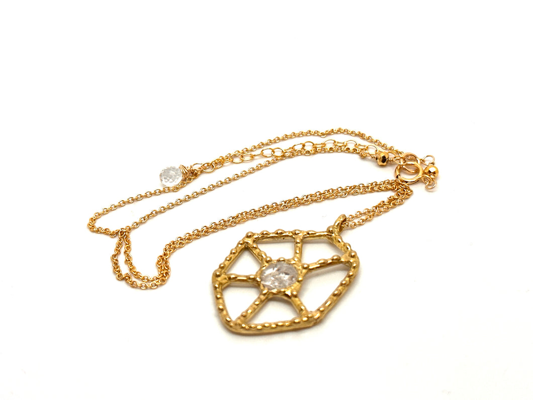 Intricate Spider Web in Brass with Clear Quartz