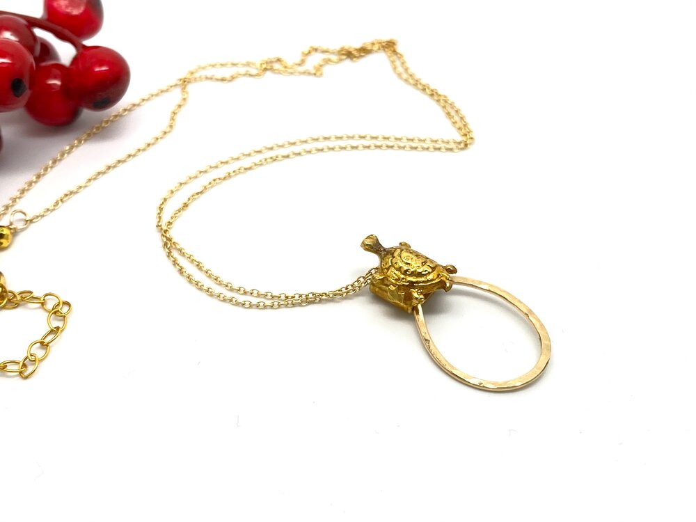 Traveling Gold Turtle Necklace on Hammered Teardrop Island